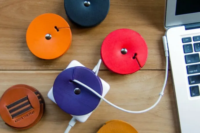 Smart leather MacBook power cord organizer. And they look great.