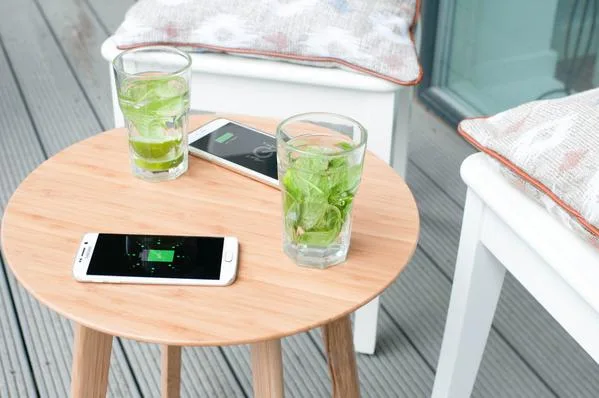 The Furniqi side table wirelessly charges your smart phone