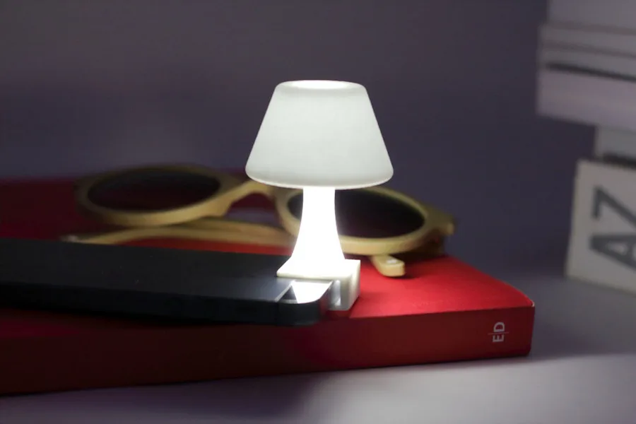 A tiny clip-on lamp for your iPhone flashlight. Adorably brilliant.