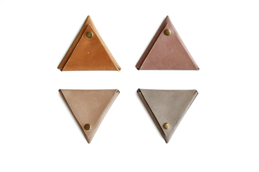 The new Triangle Coin Pouches at FashionABLE are great for tech organization