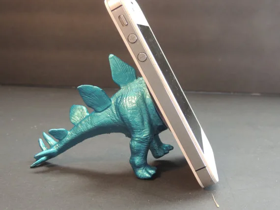 Dinosaur toy iPhone stand