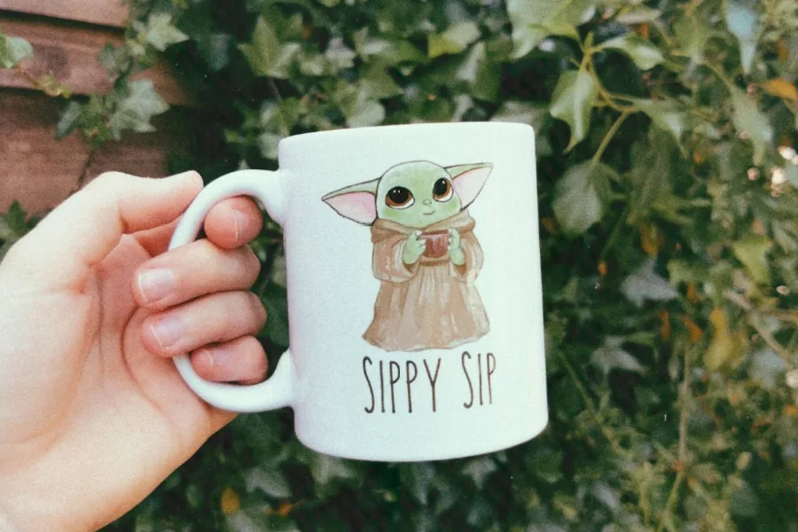 Star Wars Mandalorian gifts for fans: A Baby Yoda "baby carrier" tee from Groundhog Tees