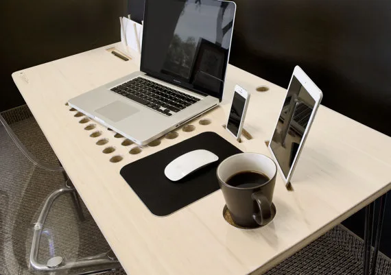 A personal tech desk designed around the idea that not seeing your cords is better than seeing them.