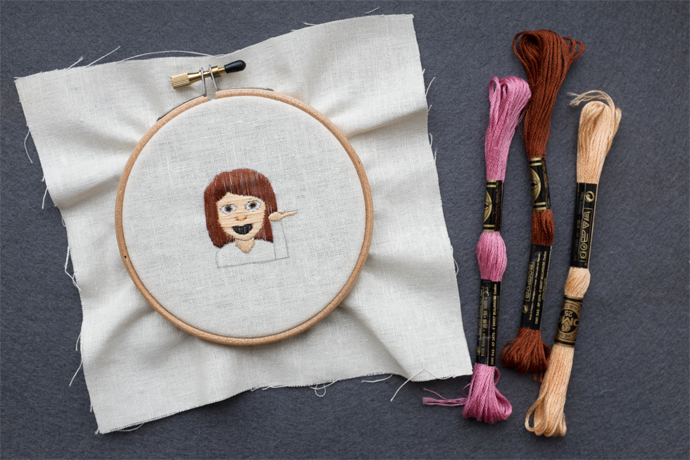 Coolest emoji gifts: info desk person emoji embroidery hoop at harllee