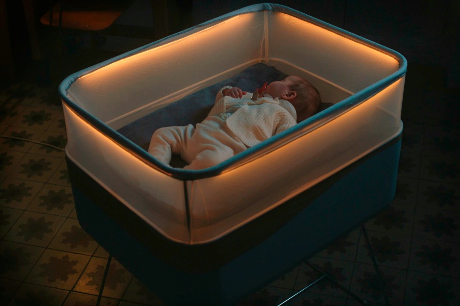 This high-tech baby cot from Ford makes it feel like you’re driving your baby around at night.